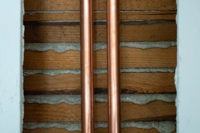 Copper pipes in a wall